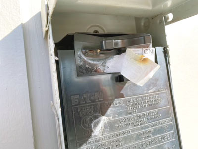 Figure 1: Melted disconnect used for EV charger